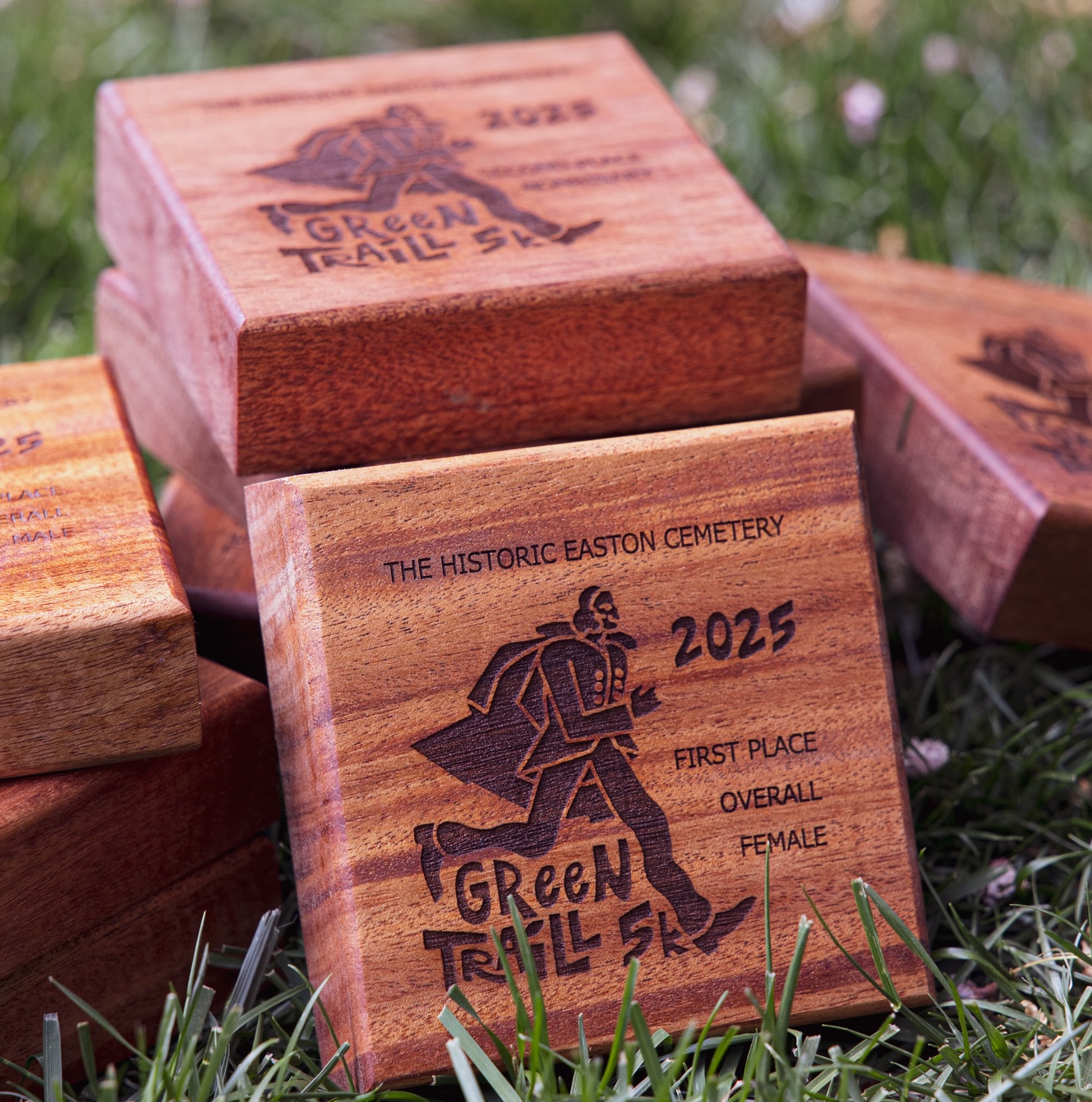 green traill awards - logo and placement carved into a wooden block