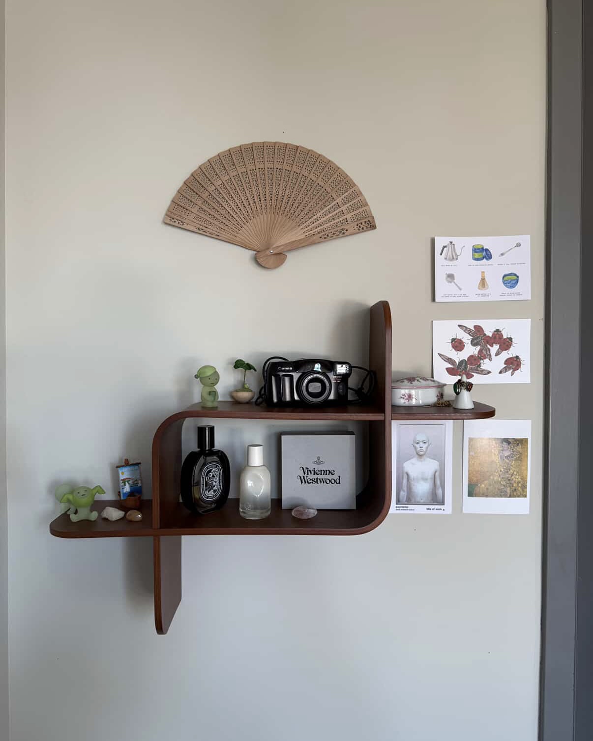 print club among other prints and items on a wall